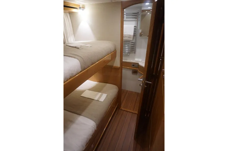  Yacht Photos Pics Elling E6 2026 yacht interior with cozy bunk beds and modern bathroom.