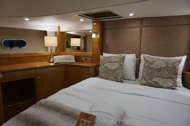  Yacht Photos Pics Luxurious cabin interior of 2026 Elling E6 yacht with elegant bedding and wood finish.