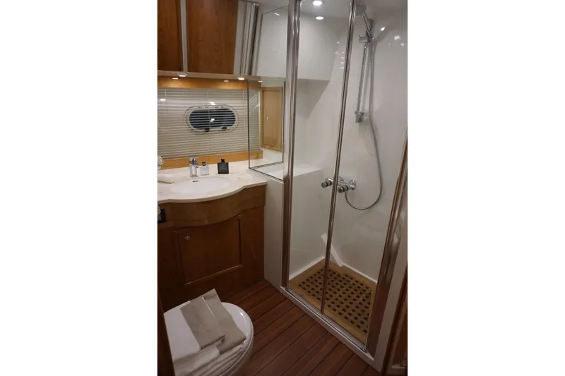  Yacht Photos Pics Luxurious bathroom in 2026 Elling E6 yacht with modern shower and wooden accents.