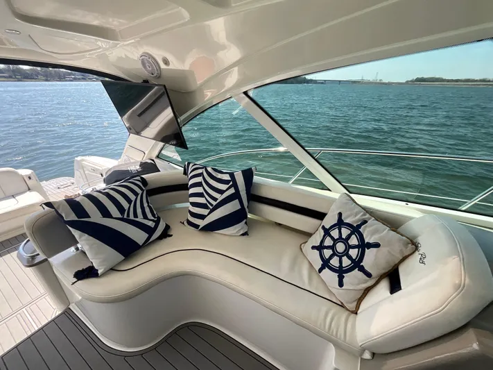  Yacht Photos Pics Luxurious 2006 Sea Ray 48 Sundancer yacht interior with nautical-themed cushions.