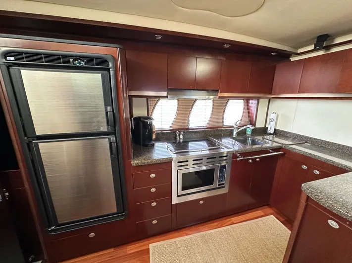  Yacht Photos Pics Luxurious kitchen interior of 2006 Sea Ray 48 Sundancer yacht with modern appliances.