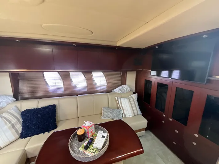  Yacht Photos Pics Luxurious interior of 2006 Sea Ray 48 Sundancer yacht with plush seating and modern amenities.