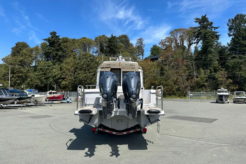 Yacht Photos Pics 2026 Cutwater C-32 C boat with dual engines, parked outdoors on a sunny day.