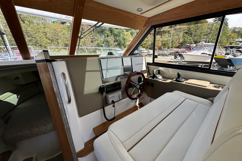  Yacht Photos Pics Interior of 2026 Cutwater C-32 C boat with Garmin navigation system and plush seating.