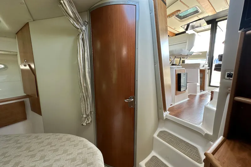  Yacht Photos Pics Interior of 2026 Cutwater C-32 C boat, featuring cabin door and steps to helm.