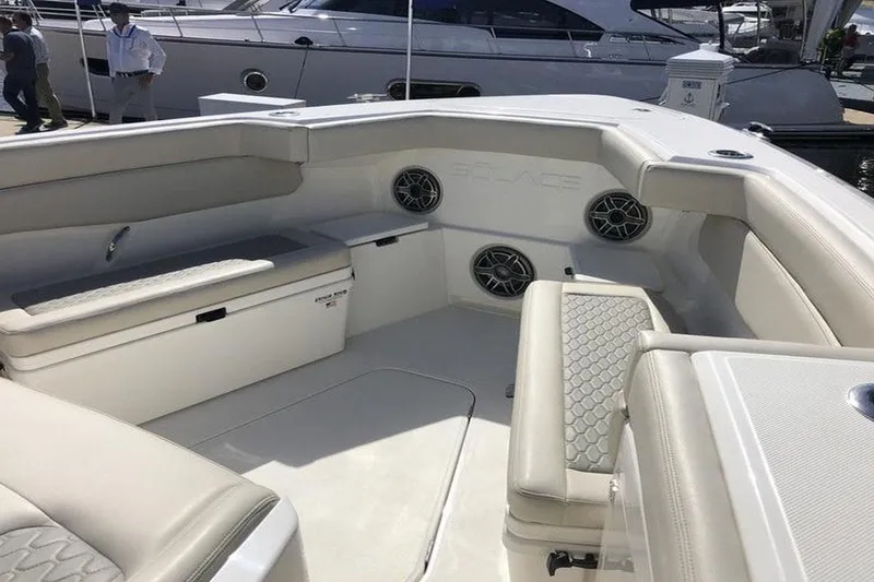  Yacht Photos Pics Manufacturer Provided Image: 2022 Solace 41 CS boat interior with cushioned seating and built-in speakers.