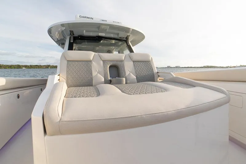  Yacht Photos Pics Manufacturer Provided Image: 2022 Solace 41 CS boat with luxurious seating on a calm water backdrop.
