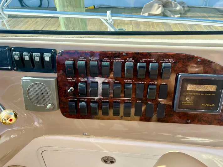 Party Of 9 Yacht Photos Pics Control panel of a 2004 Sea Ray 46 SUNDANCER boat with switches and system monitor.