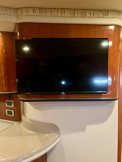 Party Of 9 Yacht Photos Pics Flat-screen TV mounted in the cabin of a 2004 Sea Ray 46 Sundancer yacht.