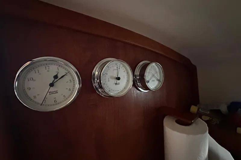 Elan II Yacht Photos Pics Gauges on a 2008 Wasque 26 boat dashboard, featuring clock and barometer.