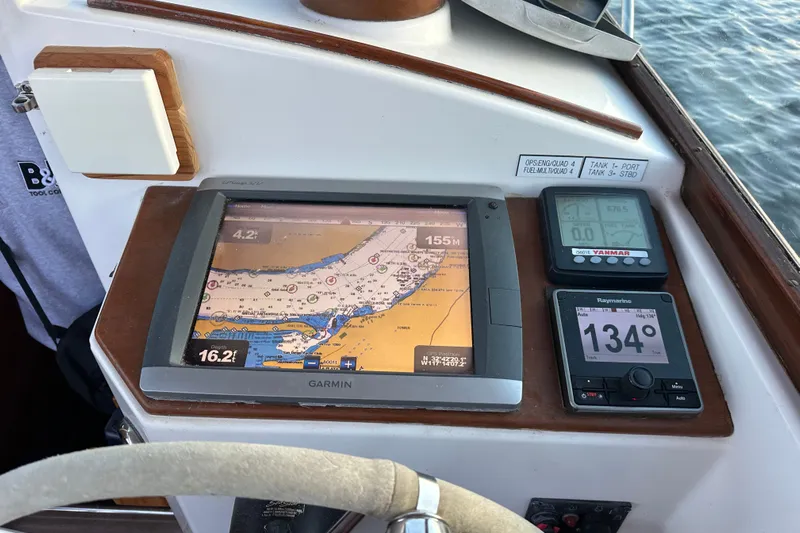 Elan II Yacht Photos Pics Boat dashboard with Garmin GPS, Yanmar display, and Raymarine autopilot on a 2008 Wasque 26.
