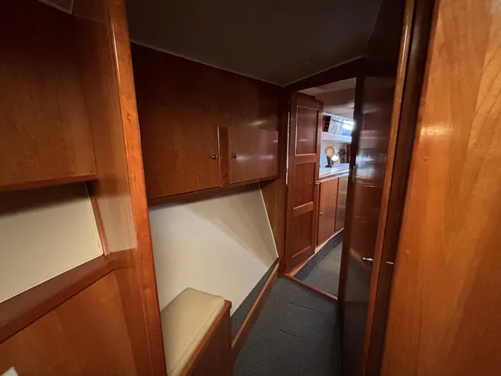 "spirit Island" Yacht Photos Pics Interior of 2004 Navigator 4400 pilot house with wooden cabinetry and hallway view.