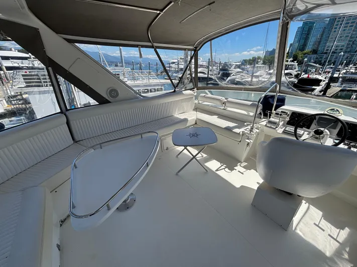 "spirit Island" Yacht Photos Pics 2004 Navigator 4400 Pilot House interior with seating, table, and marina view.