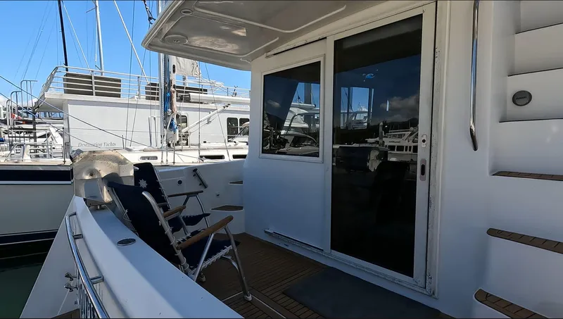 "spirit Island" Yacht Photos Pics 2004 Navigator 4400 Pilot House yacht deck with chairs and sliding glass door.