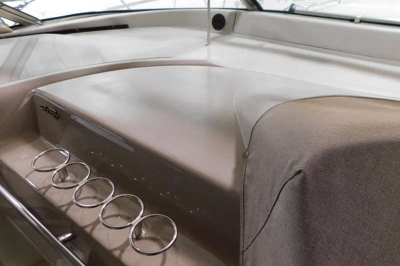  Yacht Photos Pics 1999 Sea Ray 500 Sundancer dashboard with cup holders and sleek design.