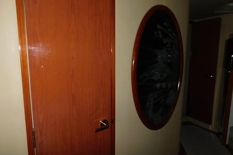  Yacht Photos Pics Interior of 1999 Sea Ray 500 Sundancer with wooden door and decorative oval panel.