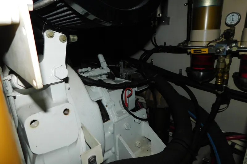  Yacht Photos Pics Engine compartment of a 1999 Sea Ray 500 Sundancer, showcasing mechanical components and filters.