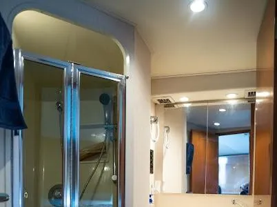 My Way Yacht Photos Pics Bathroom interior of a 1999 Viking Express with shower and mirror.