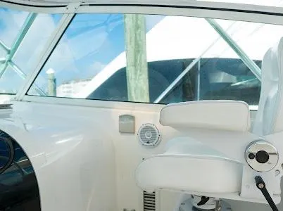 My Way Yacht Photos Pics Interior of a 1999 Viking Express boat, featuring a white captain's chair and window view.