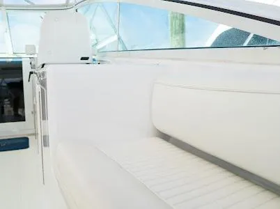 My Way Yacht Photos Pics 1999 Viking Express boat interior with white seating and helm, showcasing sleek design.