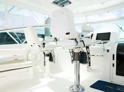 My Way Yacht Photos Pics 1999 Viking Express yacht interior with white captain chairs and modern dashboard.