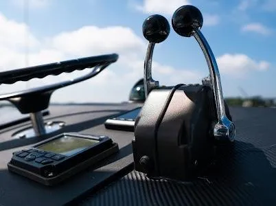 My Way Yacht Photos Pics Control panel of a 1999 Viking Express boat with throttle levers and navigation equipment.