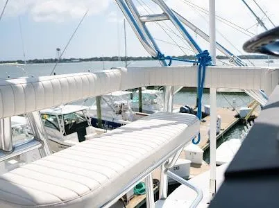 My Way Yacht Photos Pics 1999 Viking Express yacht with white seating, docked at a marina.