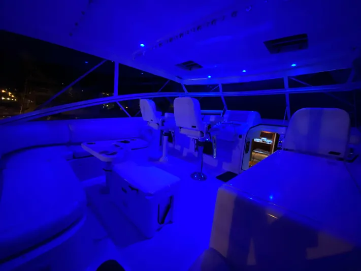 My Way Yacht Photos Pics 1999 Viking Express boat interior with blue ambient lighting at night.