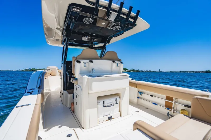  Yacht Photos Pics 2022 Scout 305 LXF boat interior with seating and ocean view.