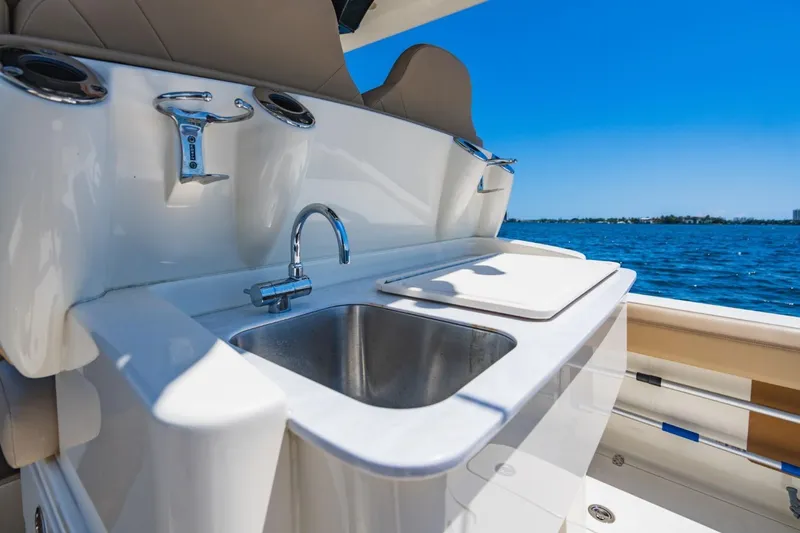  Yacht Photos Pics 2022 Scout 305 LXF boat with sink and ocean view.