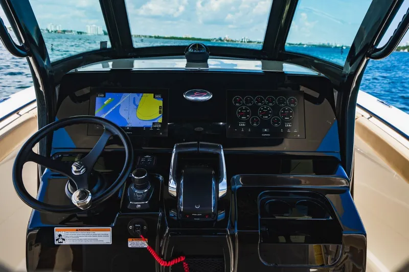  Yacht Photos Pics 2022 Scout 305 LXF boat dashboard with navigation and control systems.