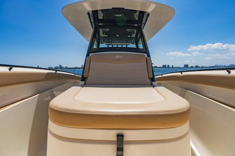  Yacht Photos Pics 2022 Scout 305 LXF boat interior with luxurious seating and ocean view.