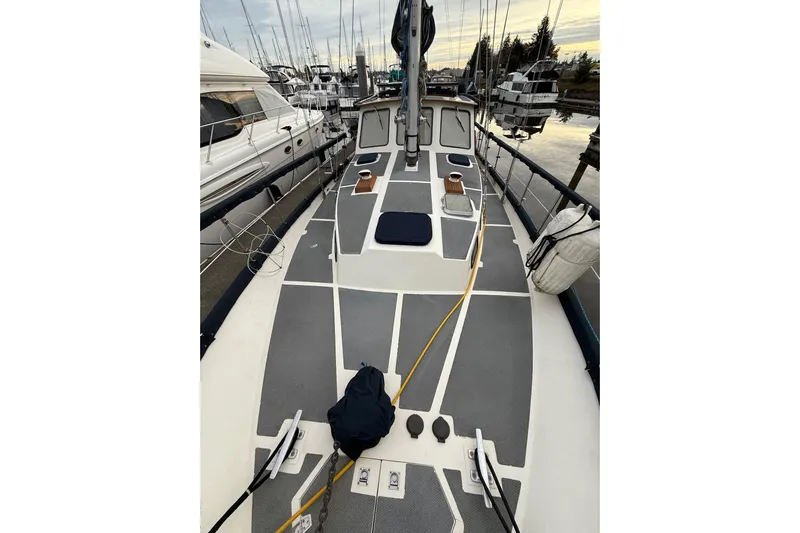  Yacht Photos Pics 1980 Nauticat Pilothouse sailboat deck view at marina, surrounded by other boats.