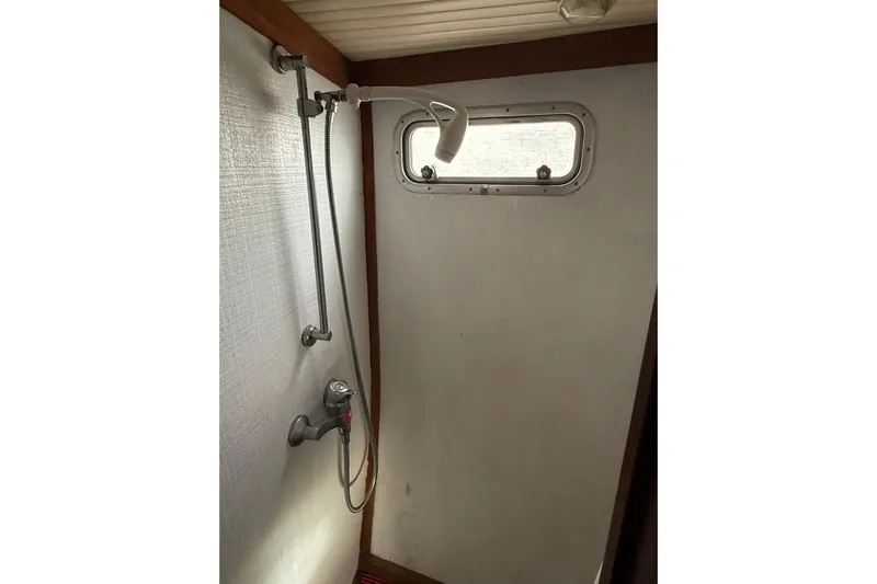  Yacht Photos Pics 1980 Nauticat Pilothouse shower area with window and adjustable showerhead.
