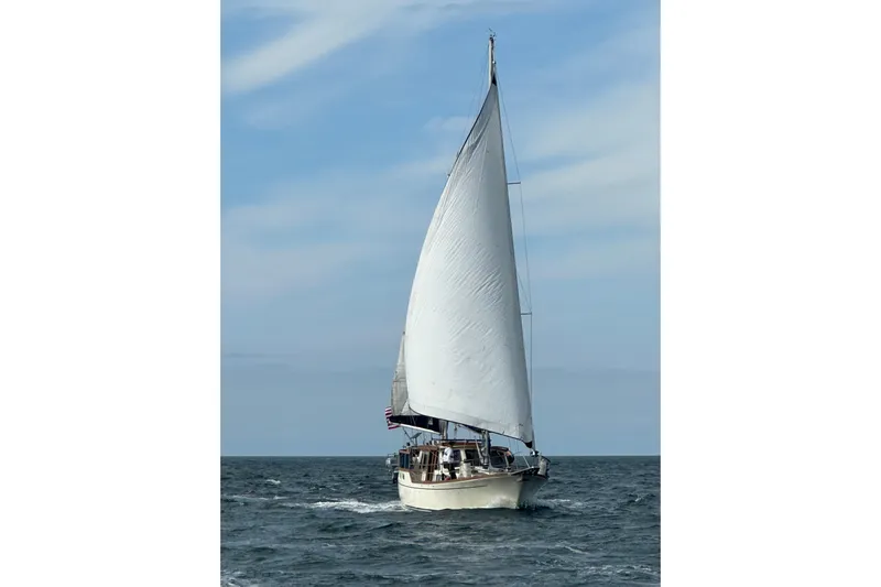  Yacht Photos Pics 1980 Nauticat Pilothouse sailboat navigating open sea under clear skies.