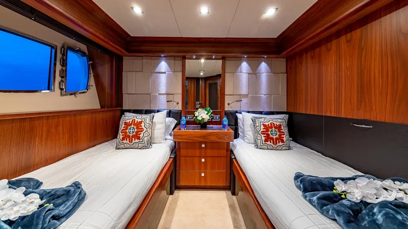 Emrys Yacht Photos Pics Luxurious twin cabin on 2010 Sunseeker Flybridge yacht with elegant wood finish.