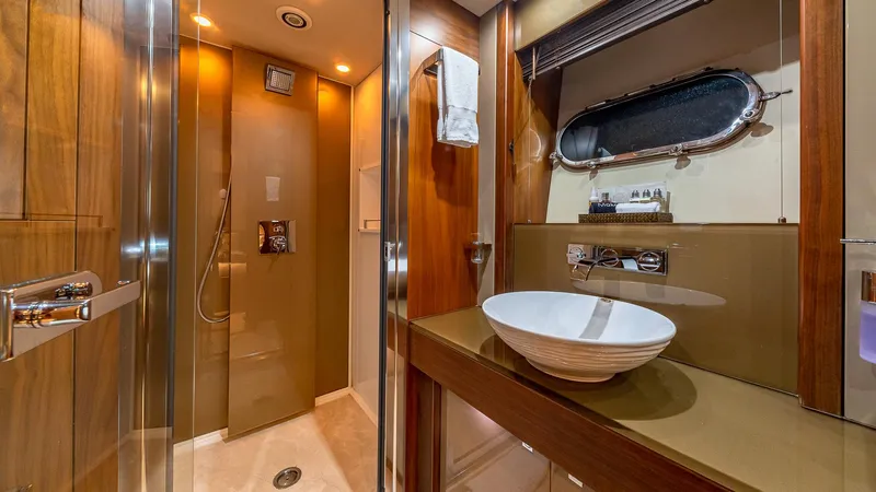 Emrys Yacht Photos Pics Luxurious bathroom on 2010 Sunseeker Flybridge yacht with modern fixtures and elegant design.