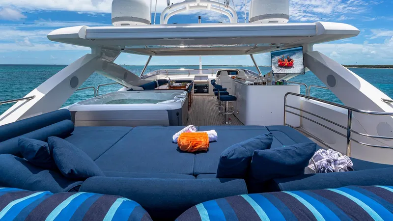 Emrys Yacht Photos Pics Luxurious 2010 Sunseeker Flybridge yacht with spacious deck, jacuzzi, and ocean view.