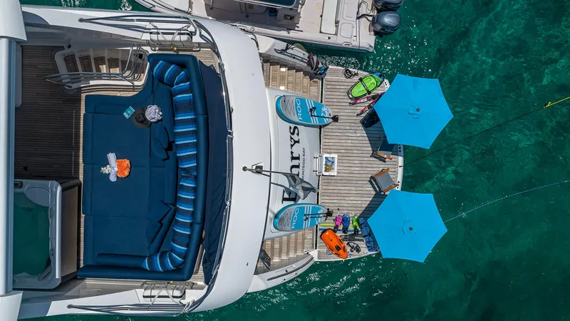 Emrys Yacht Photos Pics Aerial view of 2010 Sunseeker Flybridge yacht with deck seating and water sports gear.