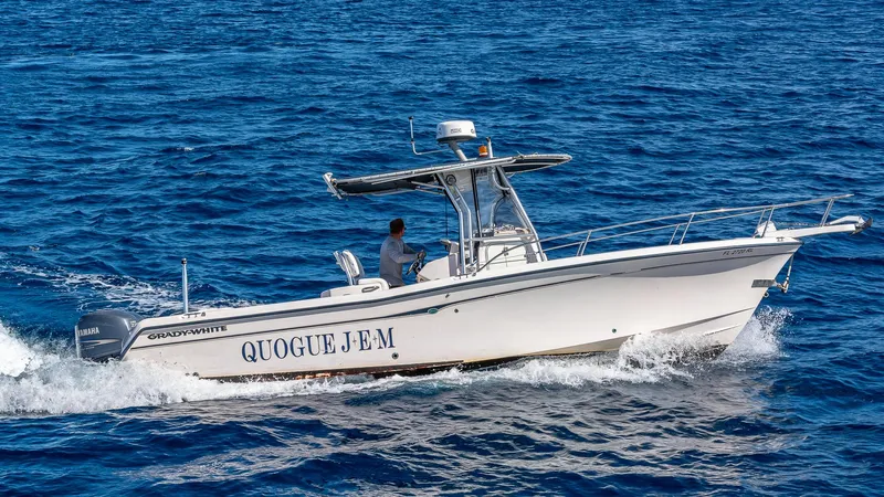 Emrys Yacht Photos Pics A boat named "QUOGUE JEM" cruising on the ocean.