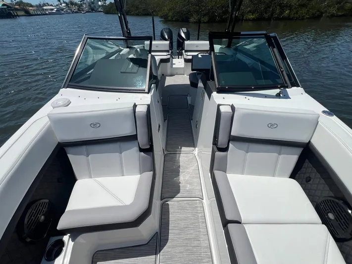  Yacht Photos Pics 2022 Cobalt R8 Outboard boat interior with sleek seating and modern design on a calm lake.