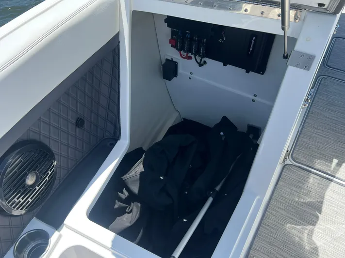  Yacht Photos Pics 2022 Cobalt R8 Outboard storage compartment with speaker and equipment.