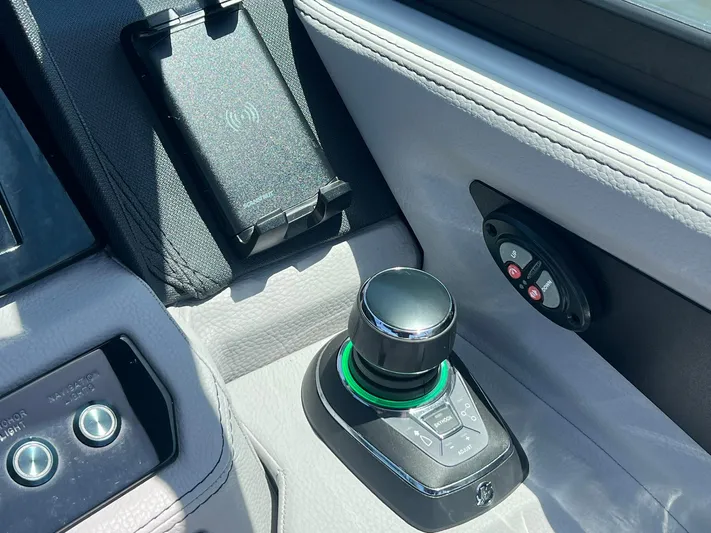  Yacht Photos Pics Control panel of 2022 Cobalt R8 Outboard boat with joystick and wireless charging pad.