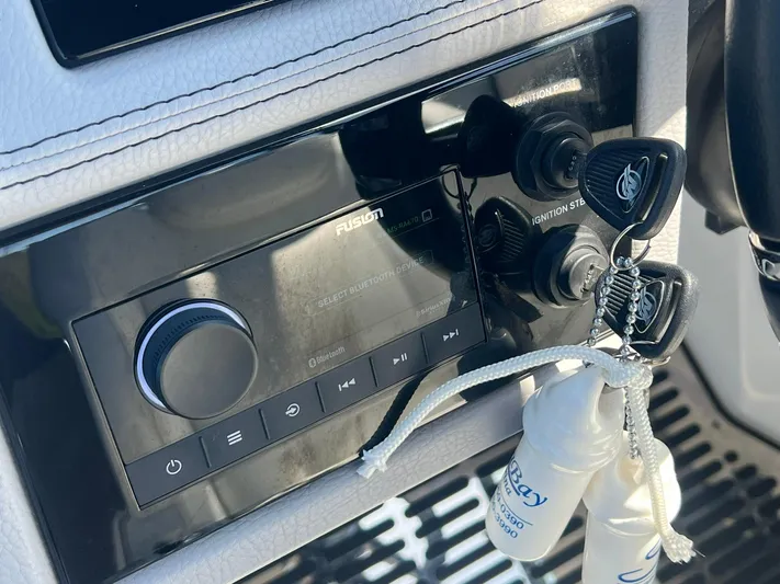  Yacht Photos Pics Control panel of 2022 Cobalt R8 Outboard with keys and audio system.