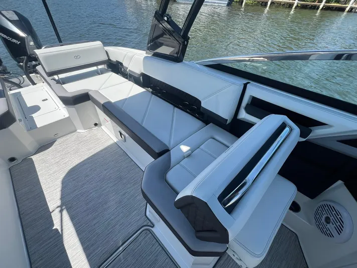  Yacht Photos Pics 2022 Cobalt R8 Outboard boat interior with sleek seating and modern design on the water.