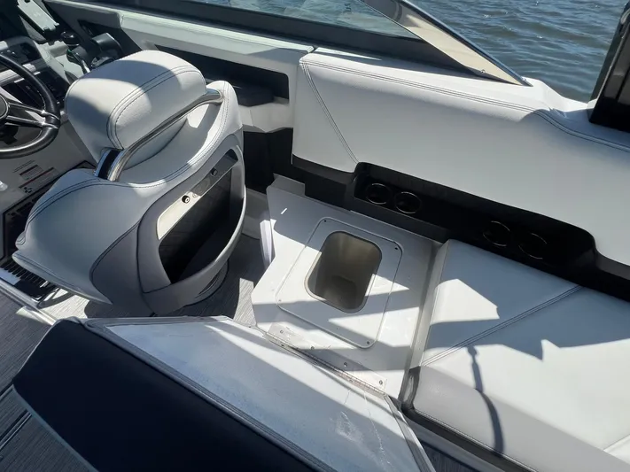  Yacht Photos Pics Interior of 2022 Cobalt R8 Outboard boat with sleek seating and storage compartment.