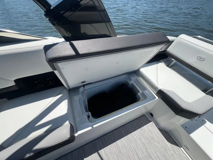  Yacht Photos Pics 2022 Cobalt R8 Outboard boat with open storage compartment, showcasing sleek interior design.