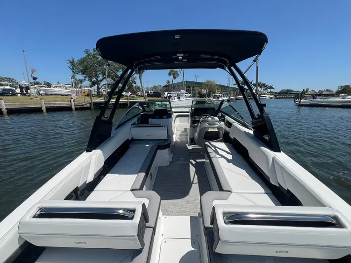  Yacht Photos Pics 2022 Cobalt R8 Outboard boat with sleek interior, docked on a sunny day.