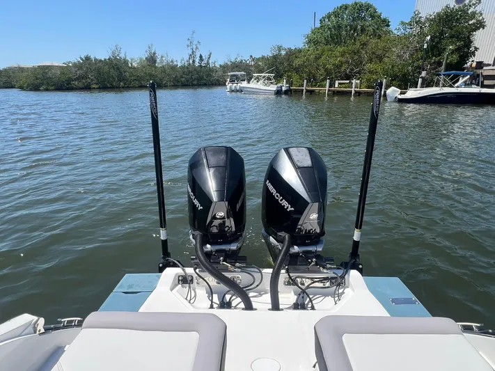  Yacht Photos Pics 2022 Cobalt R8 Outboard boat with dual Mercury engines on a calm lake.
