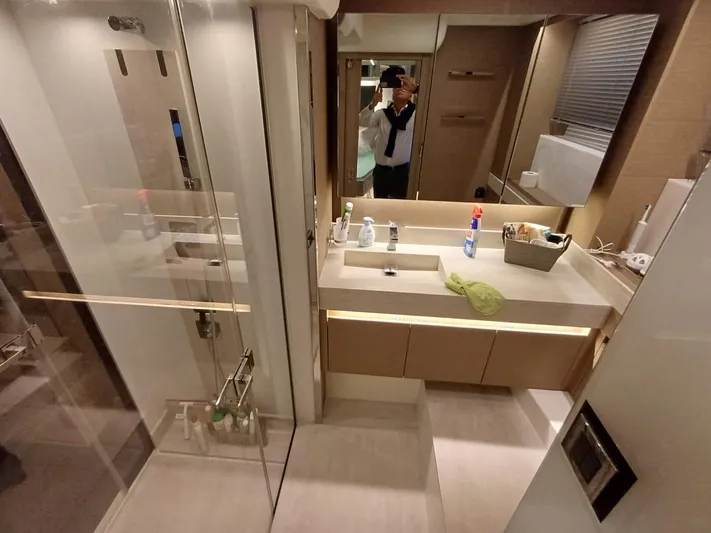  Yacht Photos Pics Modern bathroom interior in a 2020 Prestige 590 yacht, featuring sleek design and amenities.